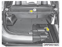 Kia Carens. Pour utiliser l'écran de sécurité de cargaison